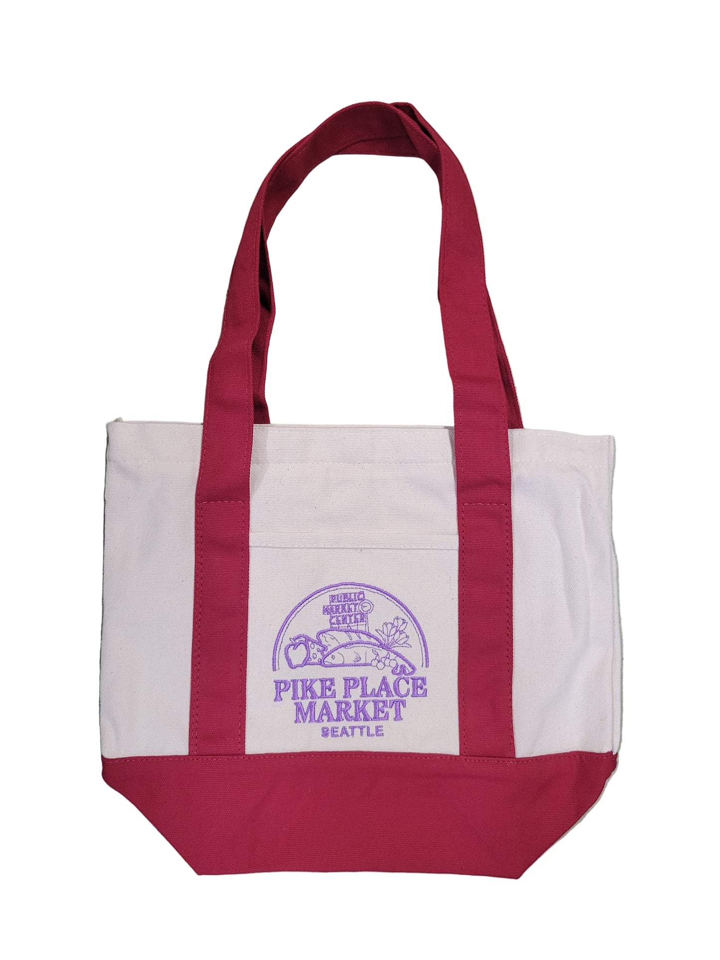 White tote bag with red handles and purple logo on a gray surface